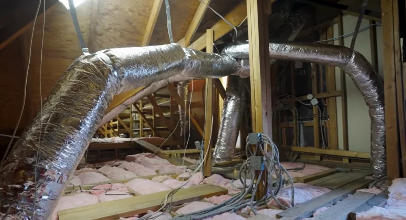 Attic ductwork and insulation being checked during a rodent inspection
