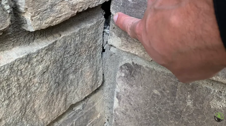 Crack and gap in an exterior brick wall that rodents can use to get inside
