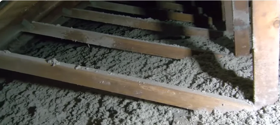 Attic after restoration with an even layer of new blown insulation